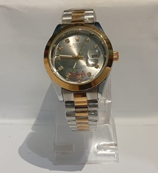 Two-tone gold and silver watch on a white background