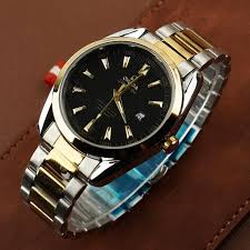 Wristwatch with a black face and silver metal strap on a brown leather background