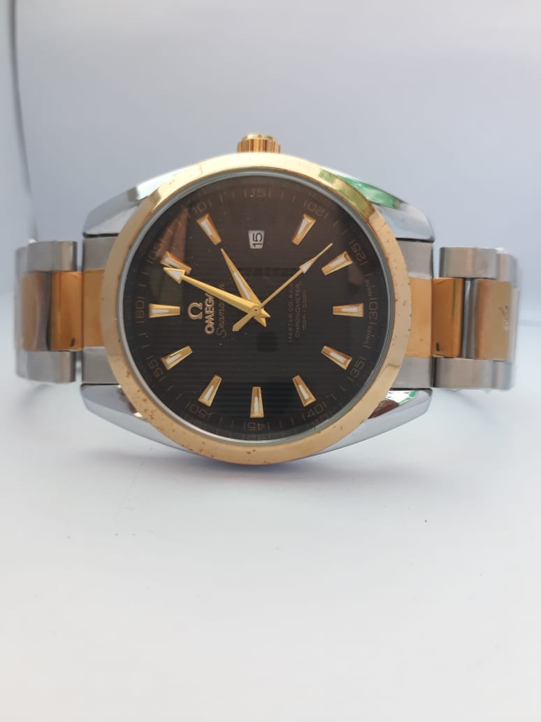Watch with a black face and gold accents on a white background