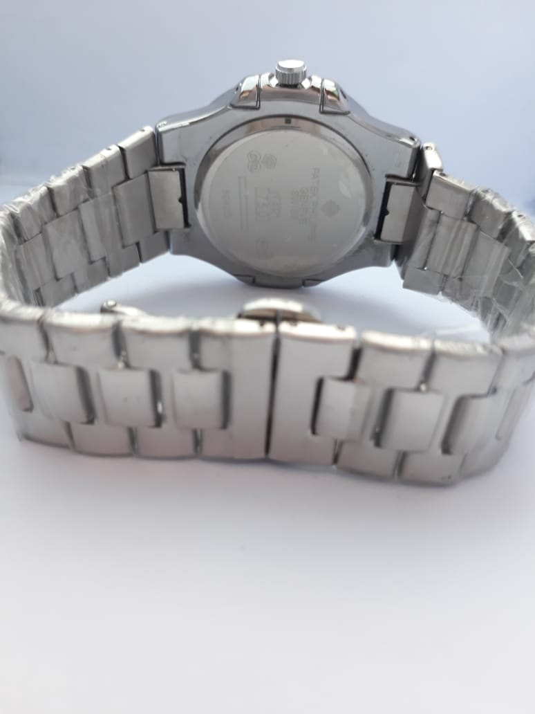 Silver watch with metal band on a white background