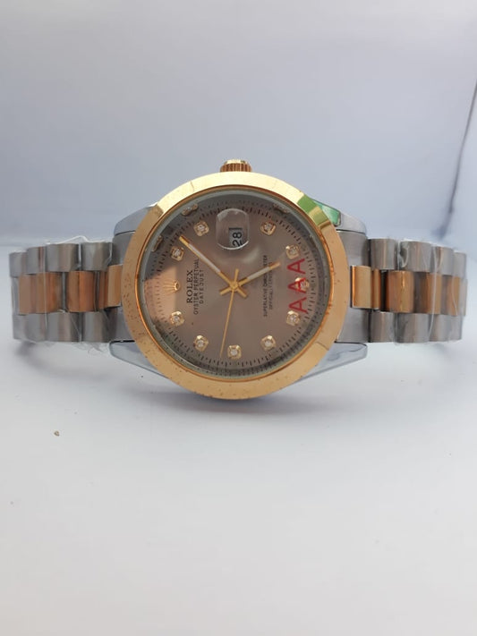 Two-tone watch with gold and silver band on a white background